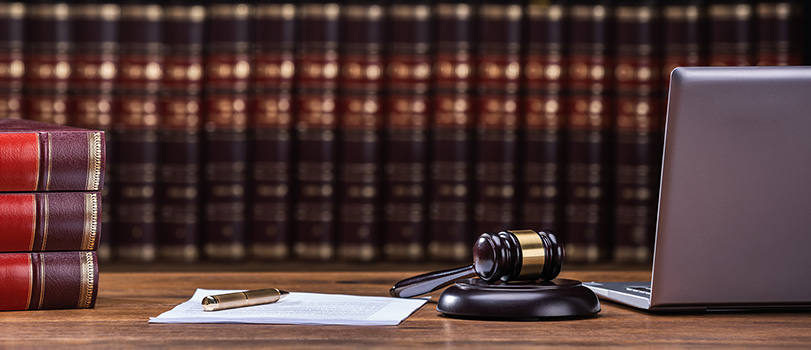 News_General_Law Legal books, gavel, and laptop