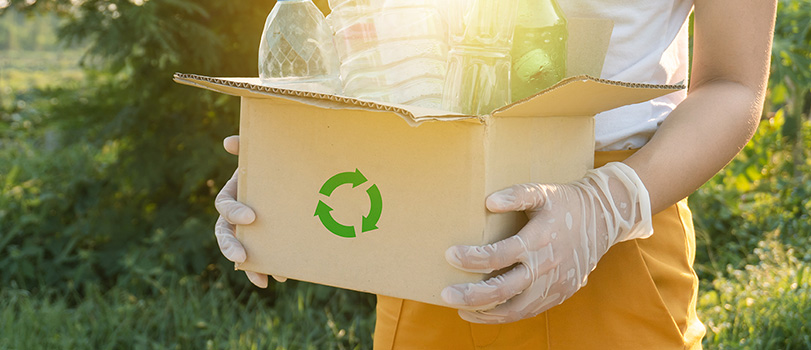 Woman holding box of recycling