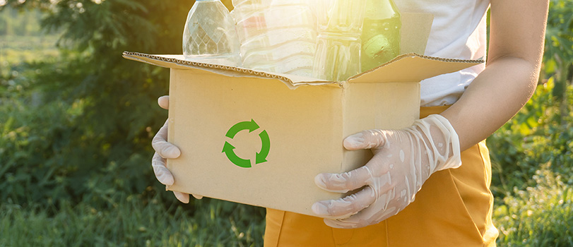 News_Recycling Woman holding box of recycling